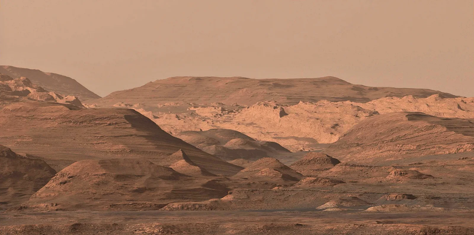This composite image looking toward the higher regions of Mount Sharp was acquired during mission sol 1099 (September 9, 2015), using Curios