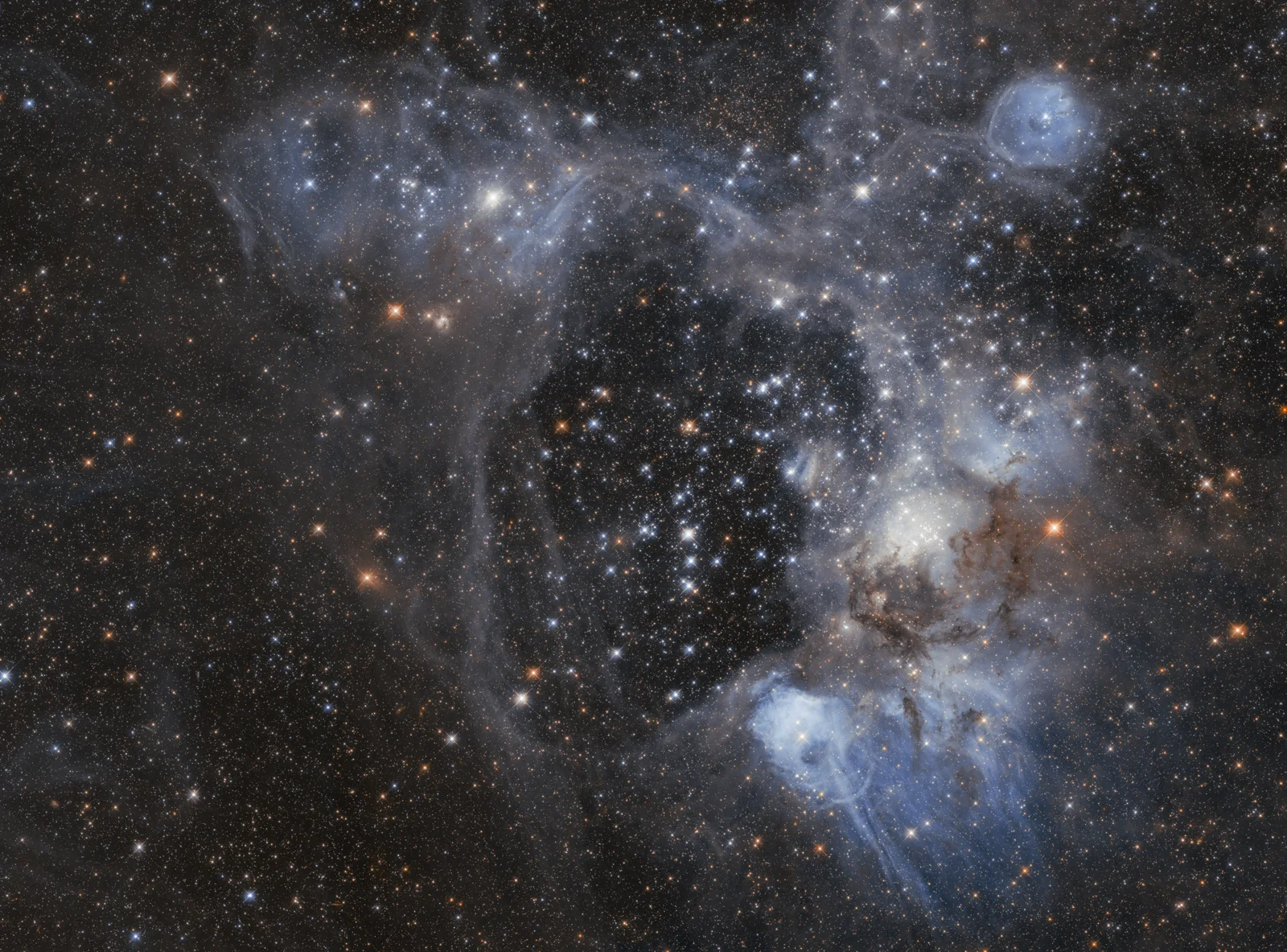 The N44 superbubble is a beautiful region of star formation near the center of the Large Magellanic Cloud, a bit north of the bar. The gas a