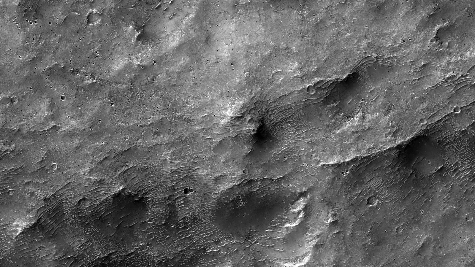 Hesperia Planum is a broad lava plain in the southern highlands of Mars. The plain is notable for its moderate number of impact craters and