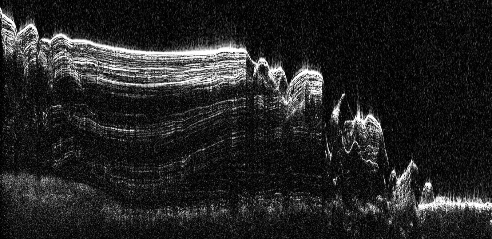 This image shows a cross-section of a portion of the north polar ice cap of Mars, derived from data acquired by the Mars Reconnaissance Orbi