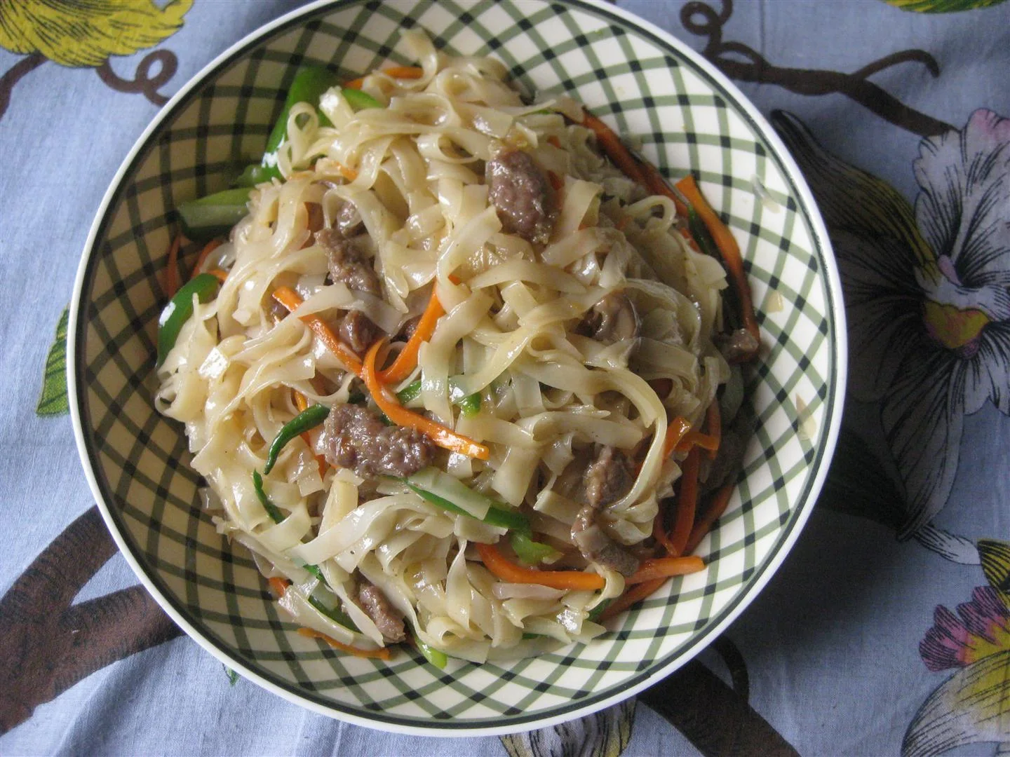 Homemade Japchae with mixed capsicum, mushroom, meat, carrot with rice noodles