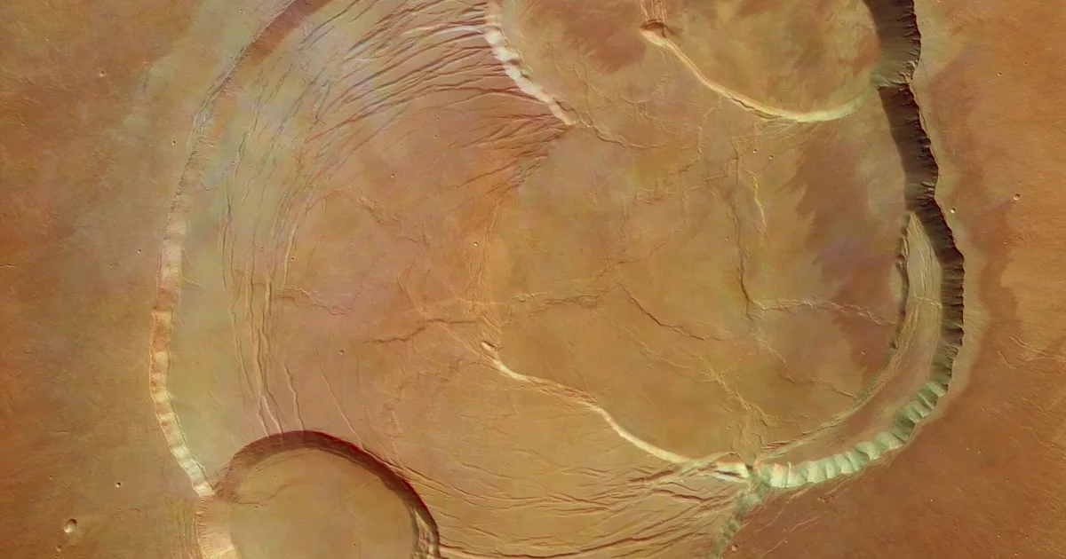 This vertical view shows the complex caldera at the summit of Olympus Mons on Mars, the highest volcano in our Solar System. Olympus Mons ha
