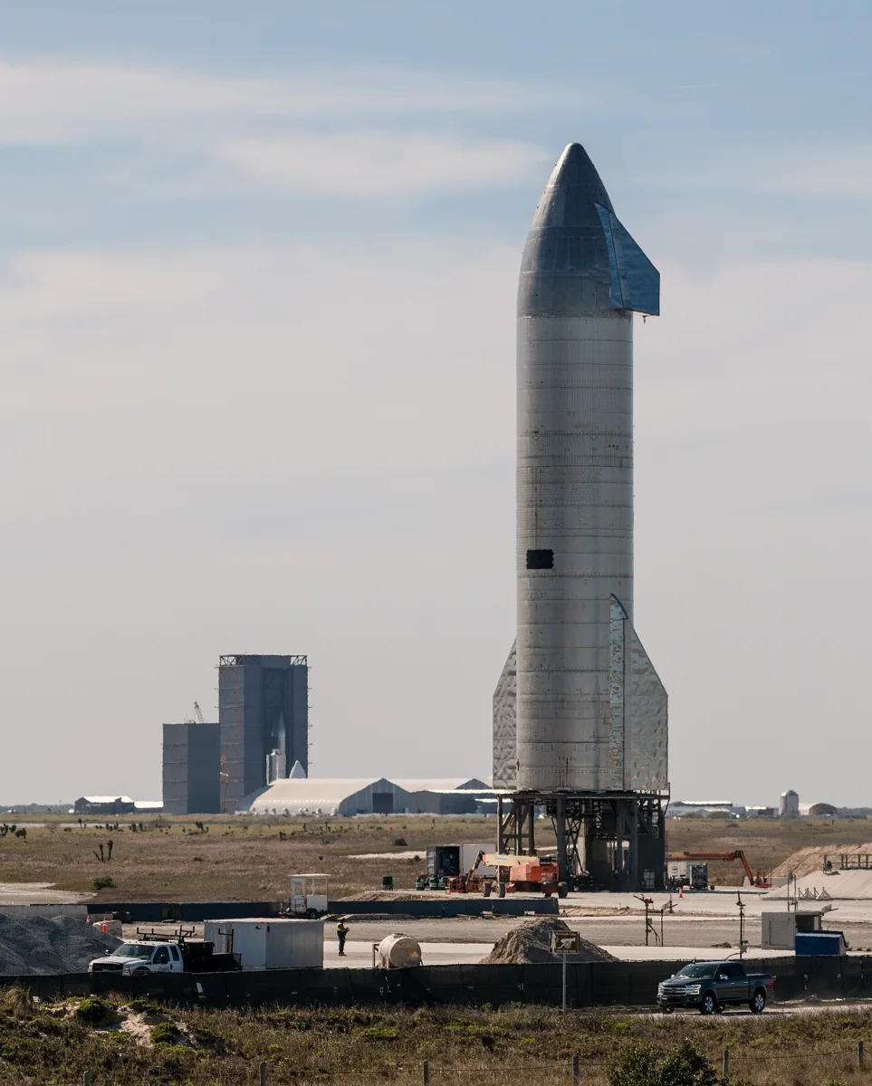 SN9 sitting on the launch pad awaiting its test flight, with SN10 under construction in the background at the build site.