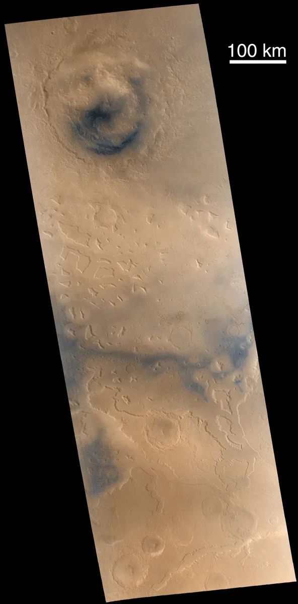 Lyot crater and the region to the south. Martian "fretted terrain" occurs in regions of buttes and mesas that stand at the erosional margin