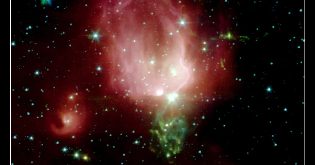 A cluster of newborn stars herald their birth in this interstellar Valentine's Day commemorative picture obtained with NASA's Spitzer Space